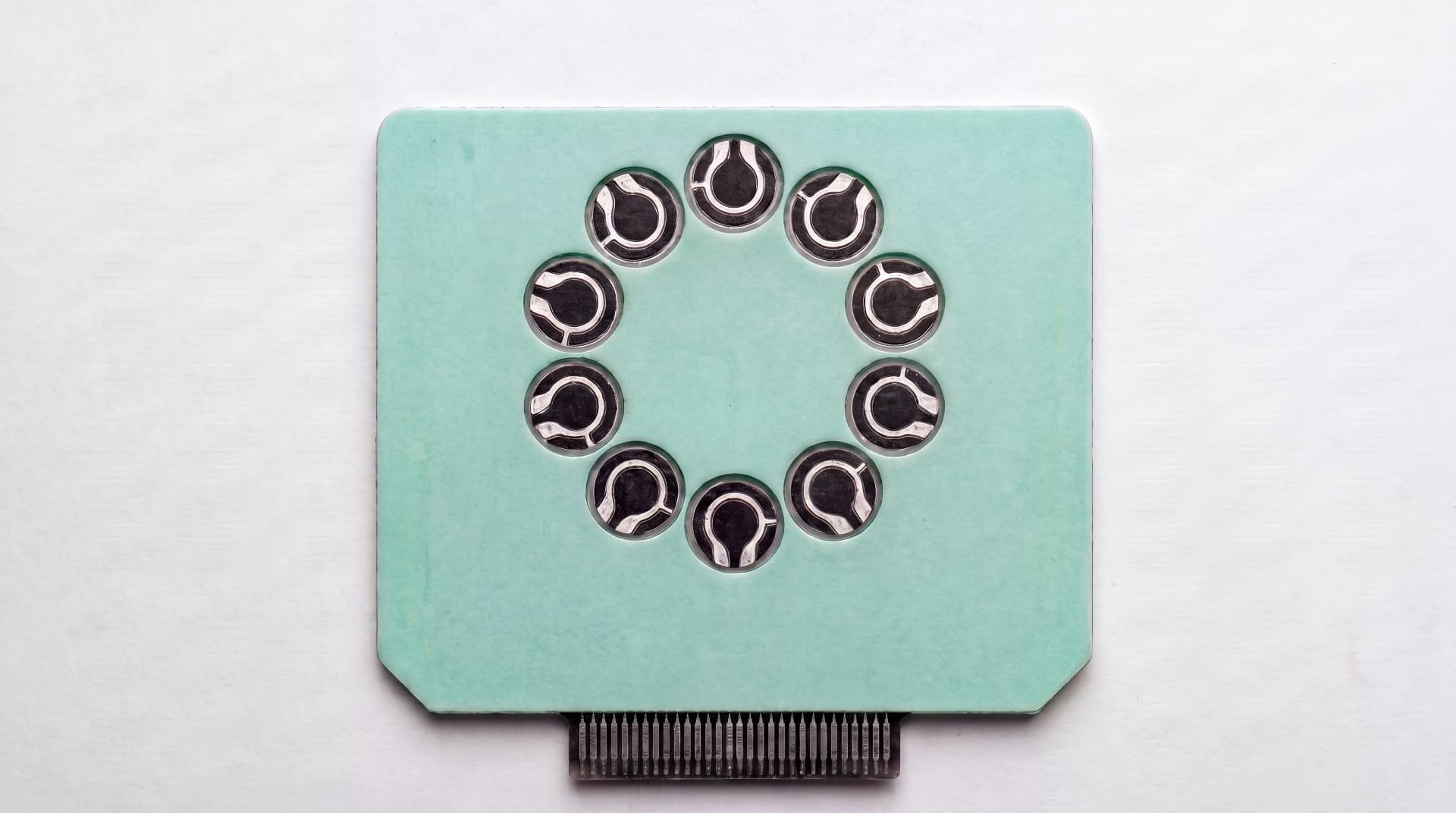 Top view of a Kora Strip showing ten circular sensing wells
